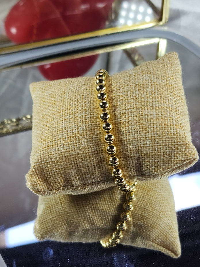 💮Set of elastic gold-colored beaded bracelets.📿