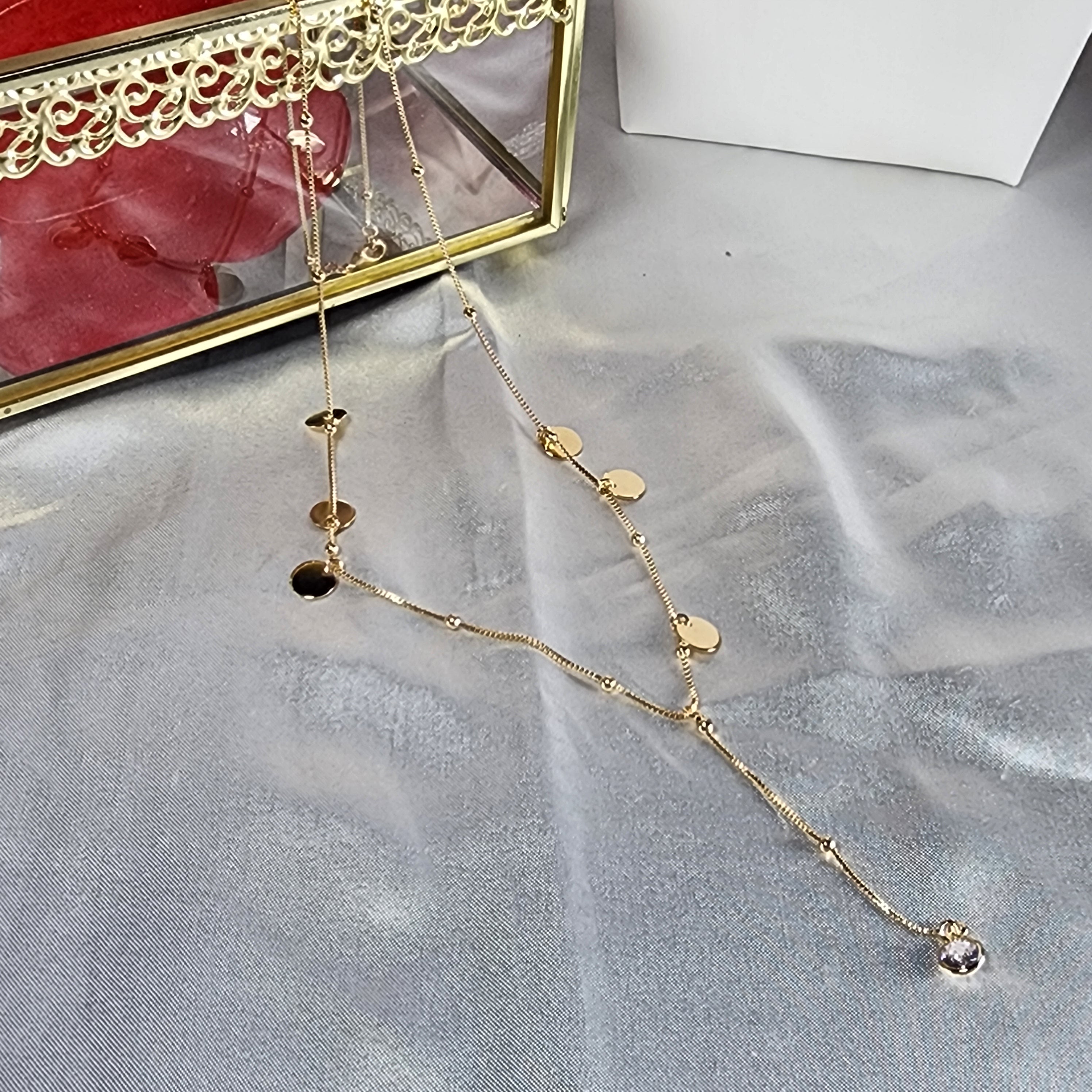 💮Necktie necklace with a shiny pendant and embellishments.📿